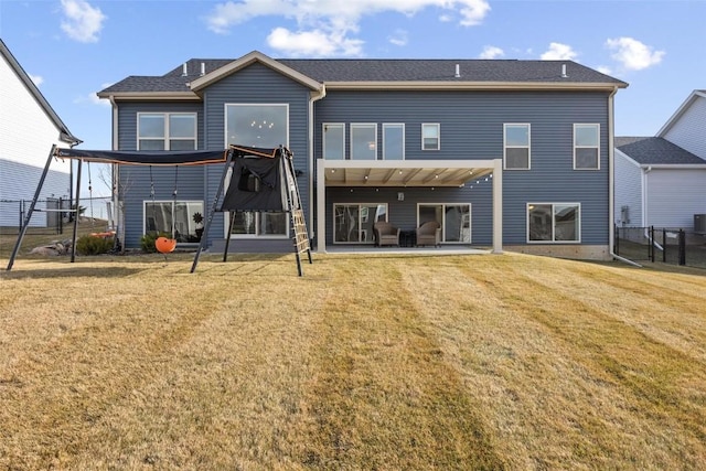 back of house featuring a yard and a patio area