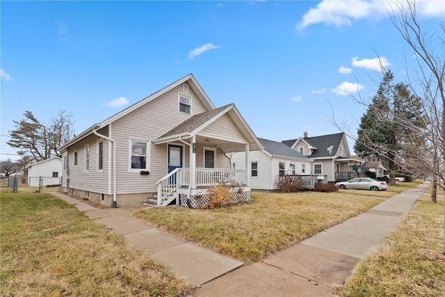 view of front facade with covered porch and a front lawn