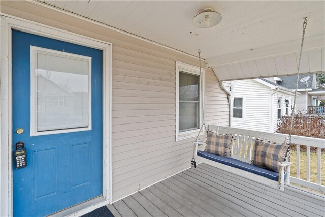 wooden terrace with a porch