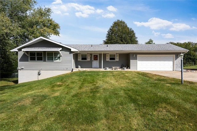 ranch-style house featuring a front yard and a garage