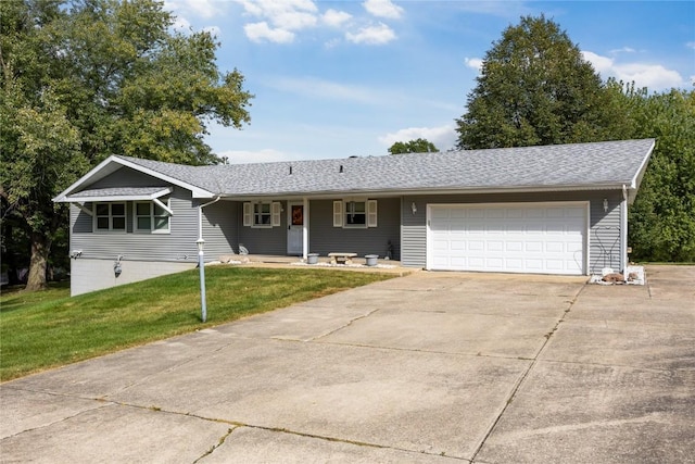 single story home with a garage and a front lawn