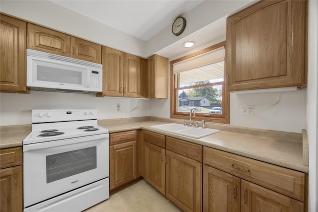 kitchen with white appliances and sink