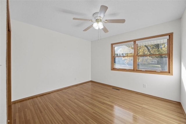 unfurnished room featuring light wood-type flooring and ceiling fan