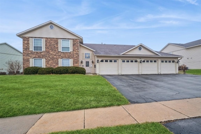 view of front of home featuring a garage and a front lawn