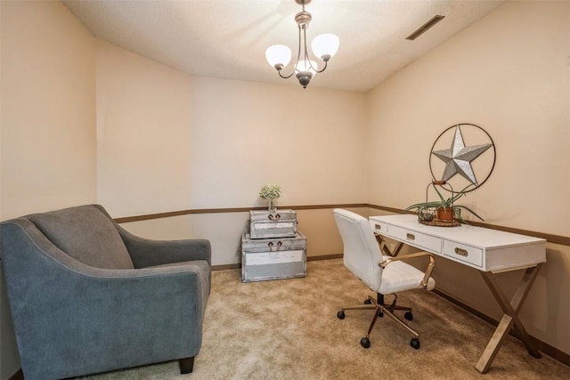 carpeted office with a notable chandelier