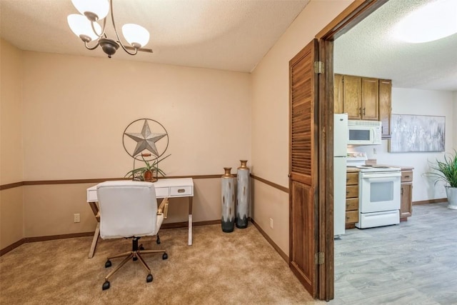 home office with light colored carpet, a chandelier, and a textured ceiling