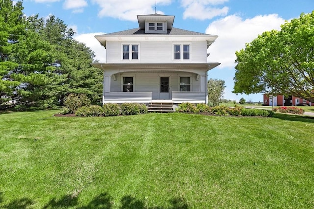 view of front of property featuring a front lawn and a porch