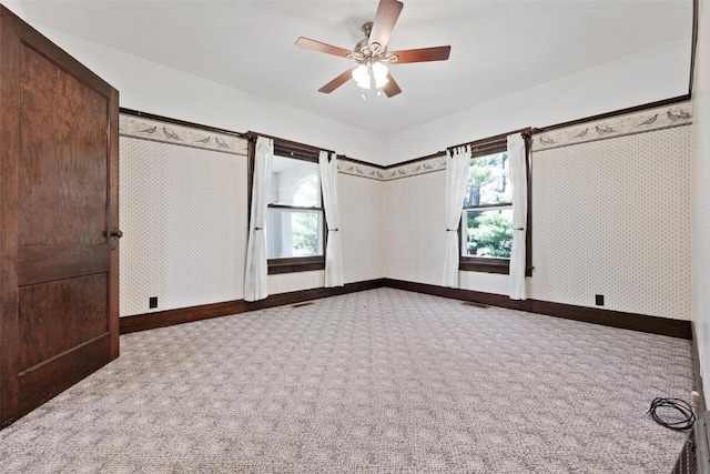 unfurnished bedroom featuring carpet flooring and ceiling fan