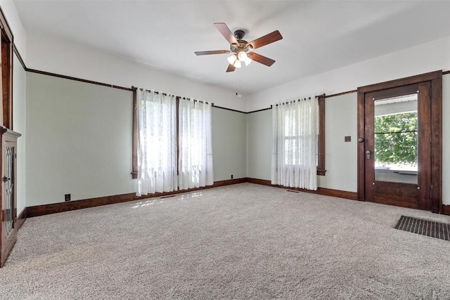 interior space featuring carpet flooring and ceiling fan