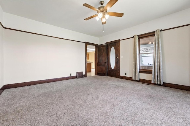 unfurnished bedroom with ceiling fan and carpet floors