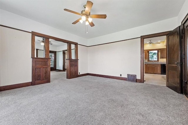 spare room with light carpet and plenty of natural light