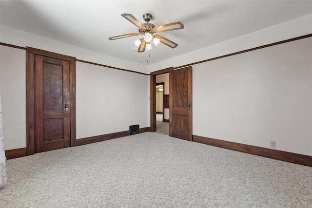 interior space featuring carpet flooring and ceiling fan