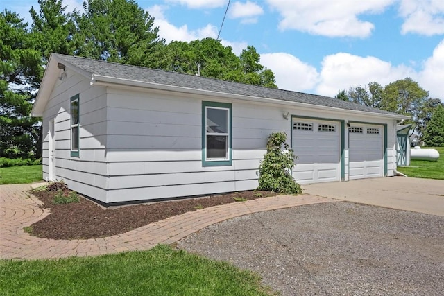 view of side of home with a garage