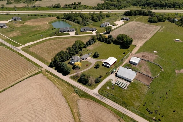 birds eye view of property with a rural view and a water view