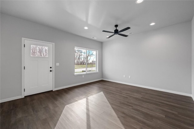 interior space featuring ceiling fan and dark wood-type flooring