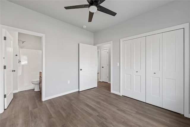 unfurnished bedroom with a closet, connected bathroom, ceiling fan, and hardwood / wood-style floors