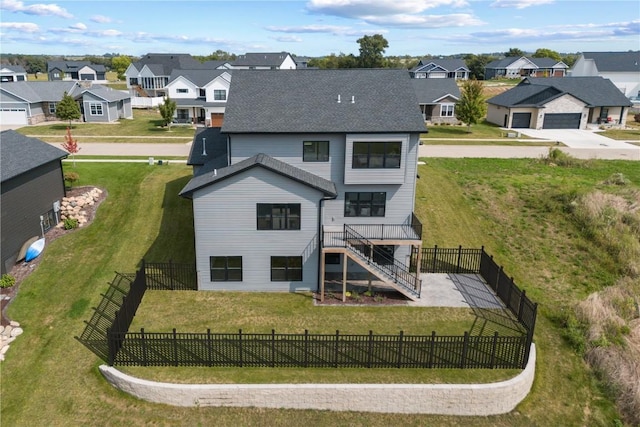 back of house featuring a yard and a wooden deck