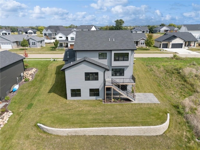 back of house with a lawn and a wooden deck