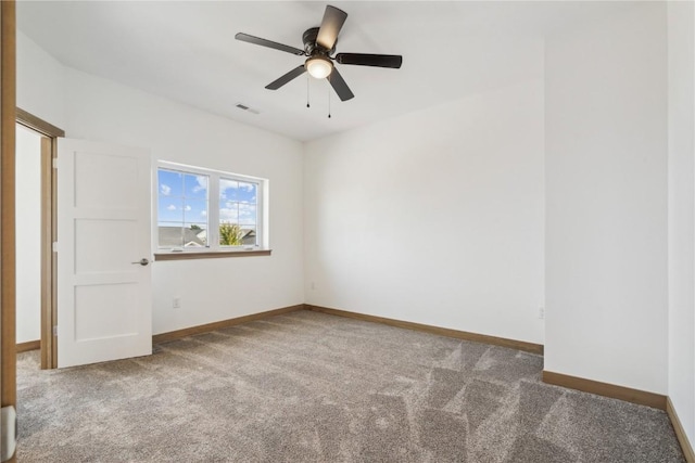 carpeted empty room featuring ceiling fan