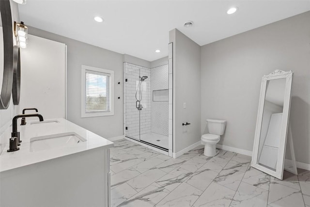 bathroom with vanity, toilet, and a tile shower