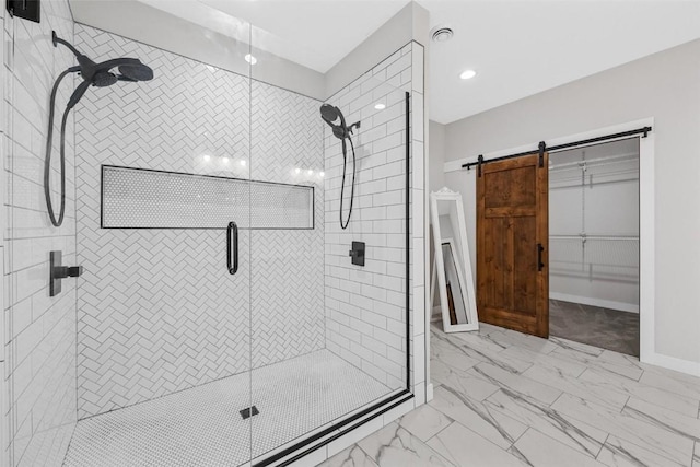 bathroom featuring a shower with door