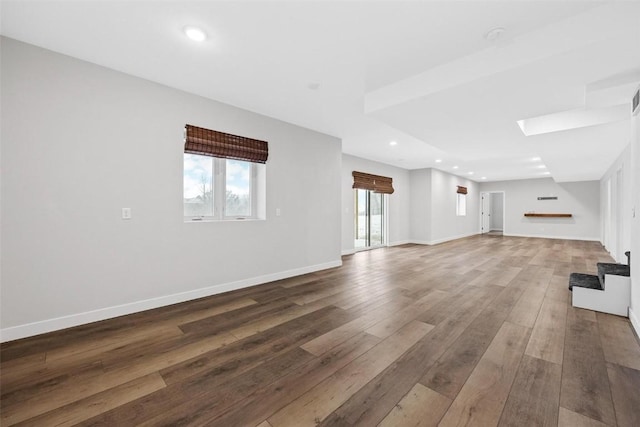 unfurnished living room featuring hardwood / wood-style flooring