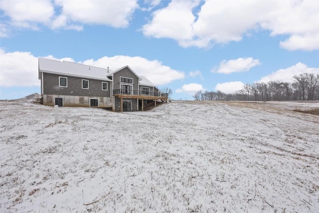 back of house featuring a wooden deck