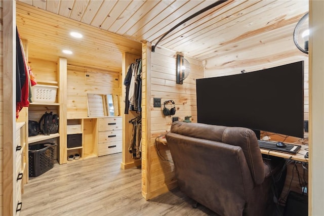 office area with wooden walls, hardwood / wood-style floors, and wooden ceiling