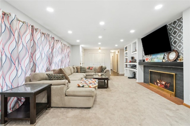 carpeted living room featuring built in shelves