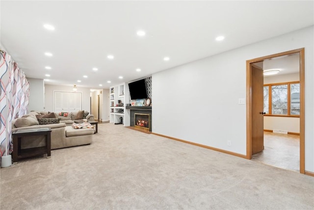 living room featuring light carpet and built in features