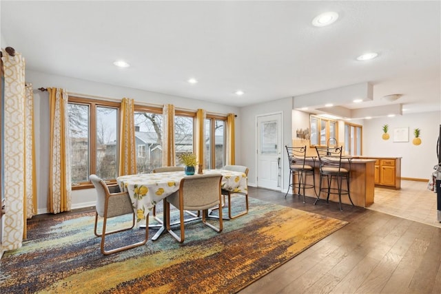 dining area with hardwood / wood-style flooring