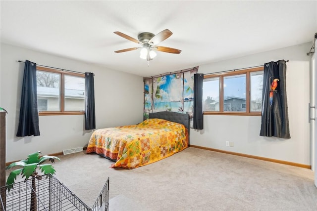 bedroom with ceiling fan and carpet