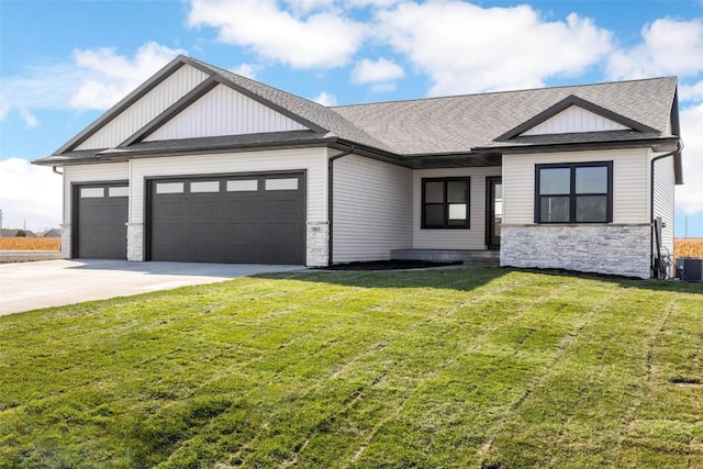 view of front of property featuring a garage and a front lawn