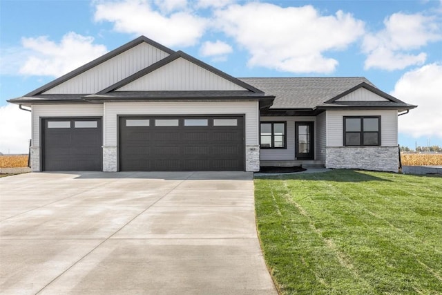 view of front of home with a front lawn and a garage