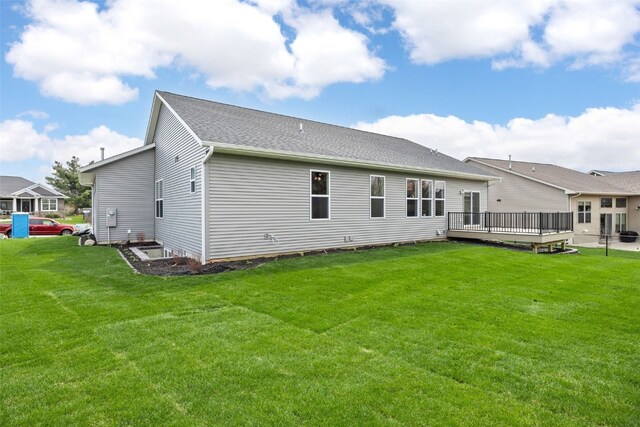 3510 Fitzroy Rd, Hiawatha, IA 52233 - rear view of property featuring a deck and a lawn