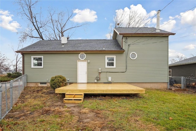 back of property featuring a lawn and a wooden deck