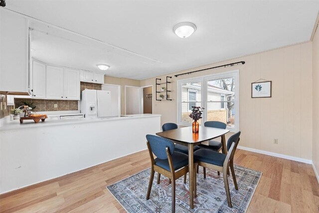 dining area with light hardwood / wood-style floors