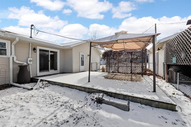 snow covered patio with a gazebo