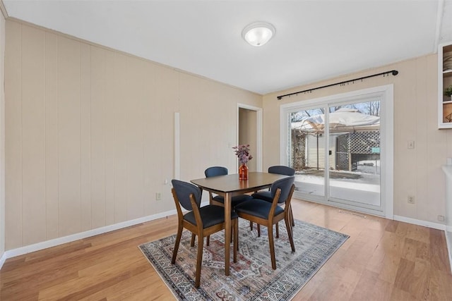 dining space featuring light hardwood / wood-style flooring