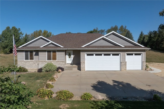 view of front of home with a garage and a front yard