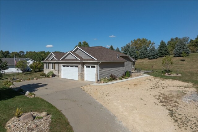 view of front of house featuring a front yard and a garage