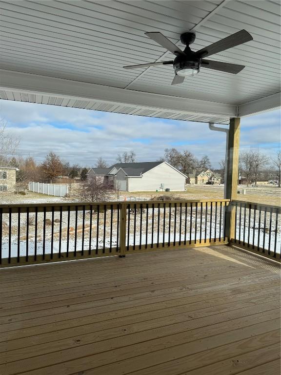 wooden terrace featuring ceiling fan