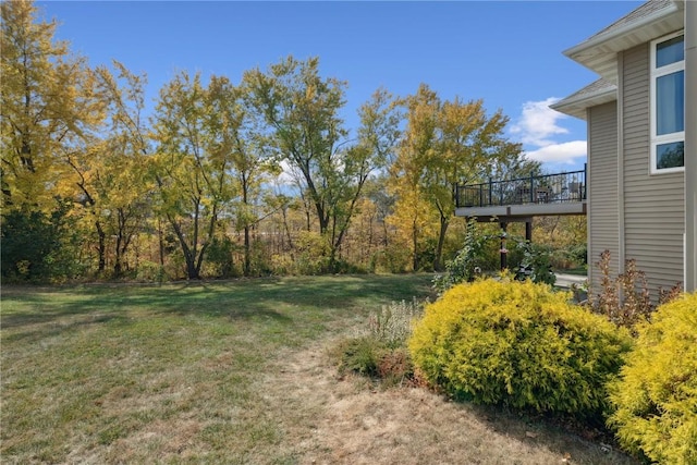 view of yard featuring a wooden deck