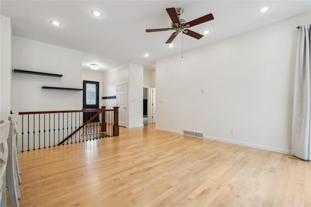 unfurnished room featuring baseboards, recessed lighting, visible vents, and light wood-style floors