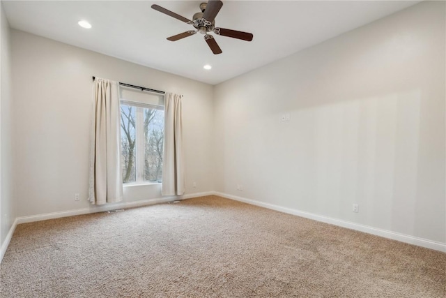 spare room with carpet floors and baseboards