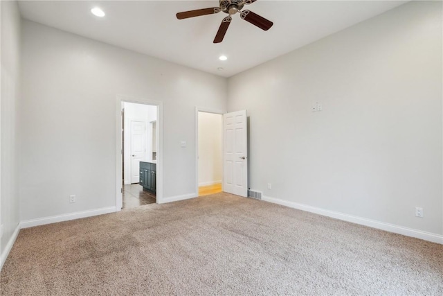 unfurnished bedroom with baseboards, visible vents, connected bathroom, carpet flooring, and recessed lighting