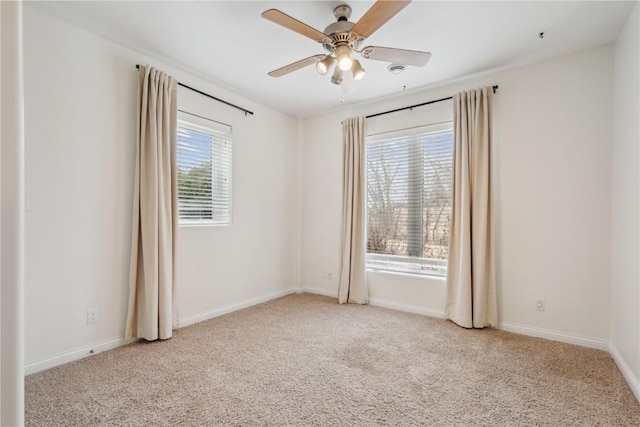 unfurnished room with carpet floors, ceiling fan, and baseboards