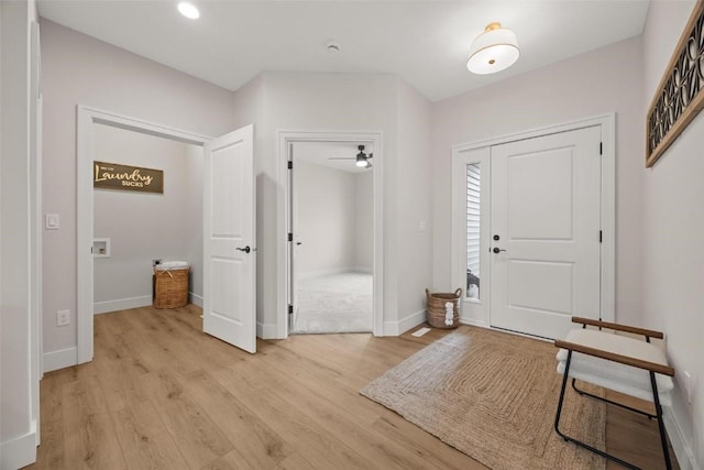 entryway with ceiling fan and light hardwood / wood-style floors