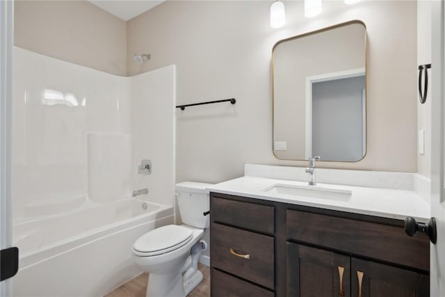 full bathroom with shower / tub combination, vanity, toilet, and wood-type flooring