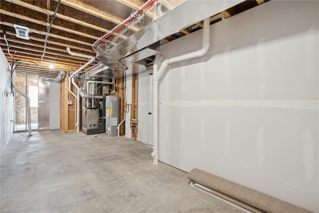 basement featuring electric water heater and heating unit